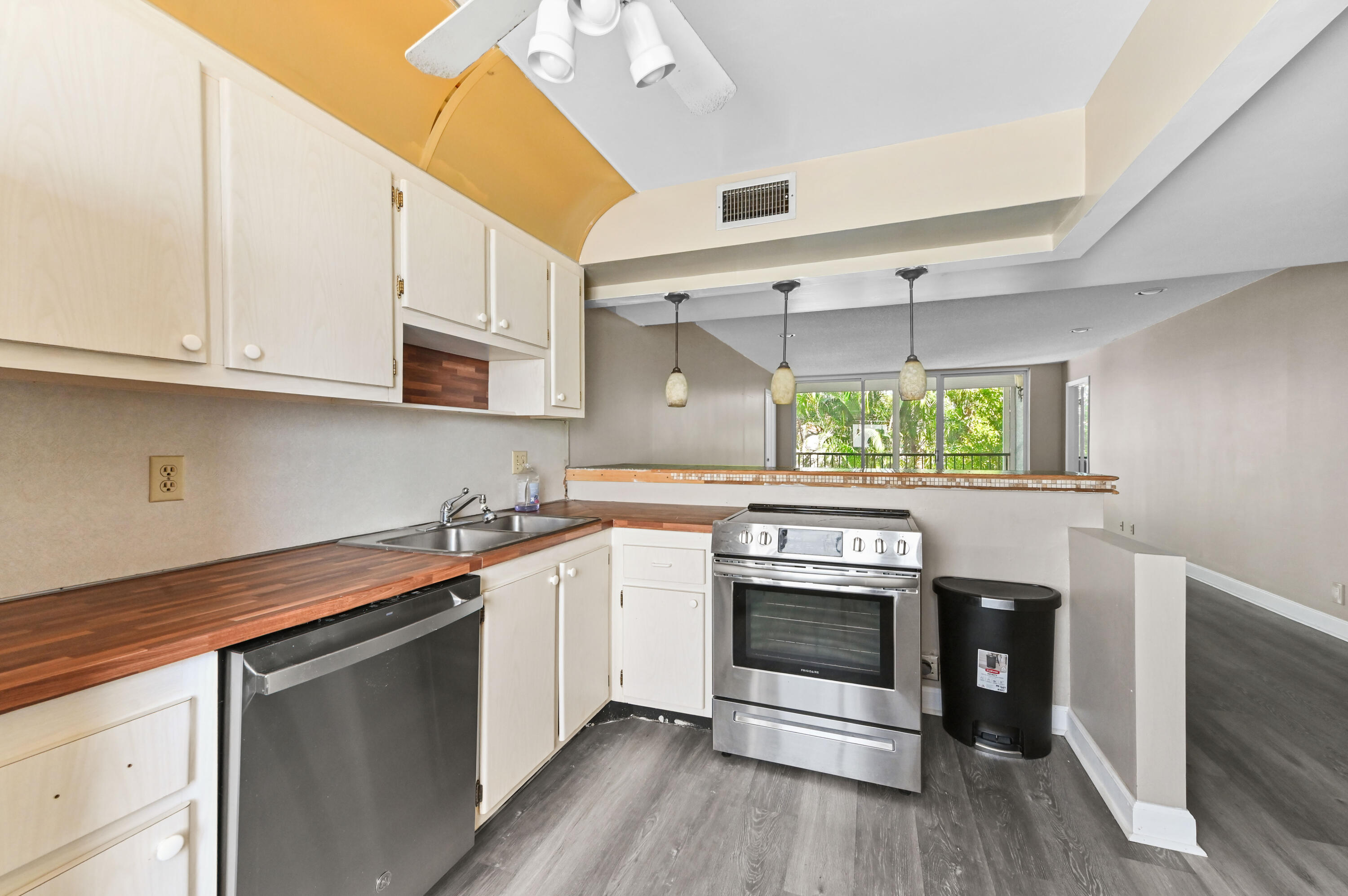 4080 Tivoli Court, Unit 202 Lake Worth, FL 33467 - Photo 4 of 28 a kitchen with a stove and a sink