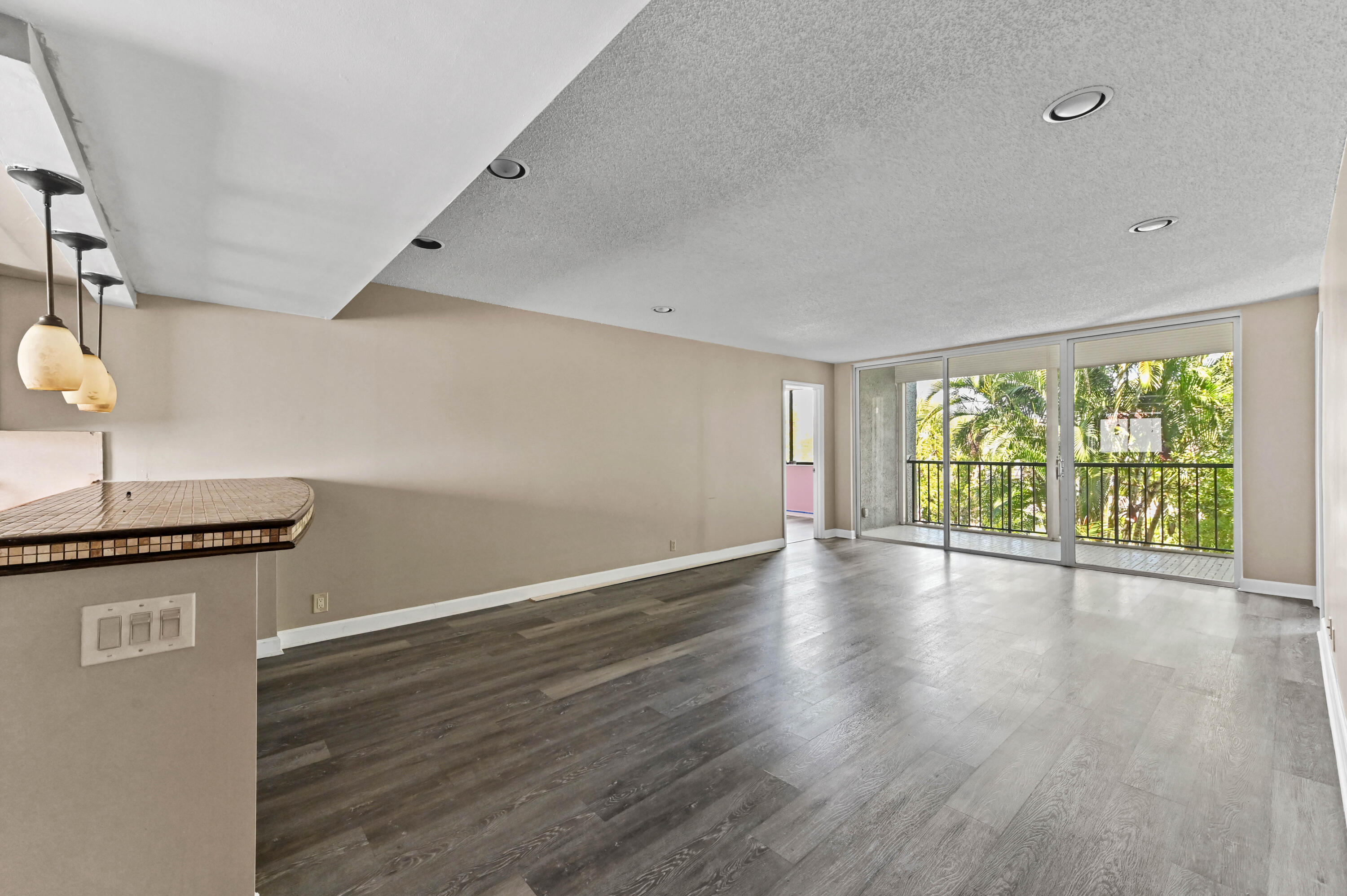 4080 Tivoli Court, Unit 202 Lake Worth, FL 33467 - Photo 7 of 28 a view of a livingroom with wooden floor