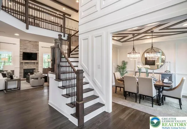 a view of entryway livingroom and hall with wooden floor