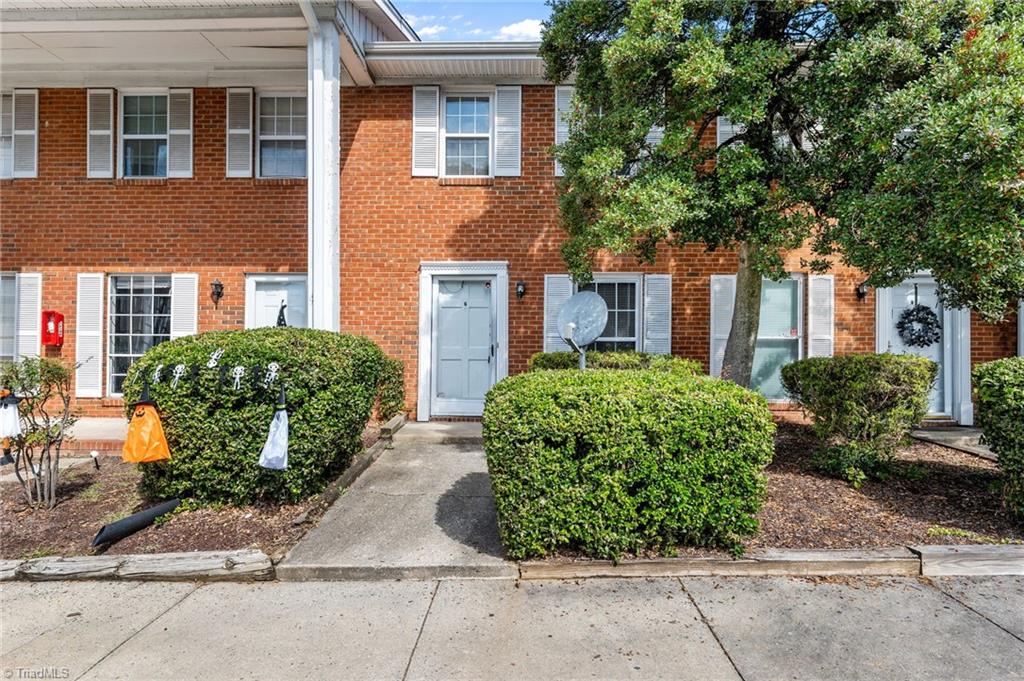 1315 West Meadowview Road, Unit G Greensboro, NC 27403 - Photo 1 of 17 FRONT OF BUILDING