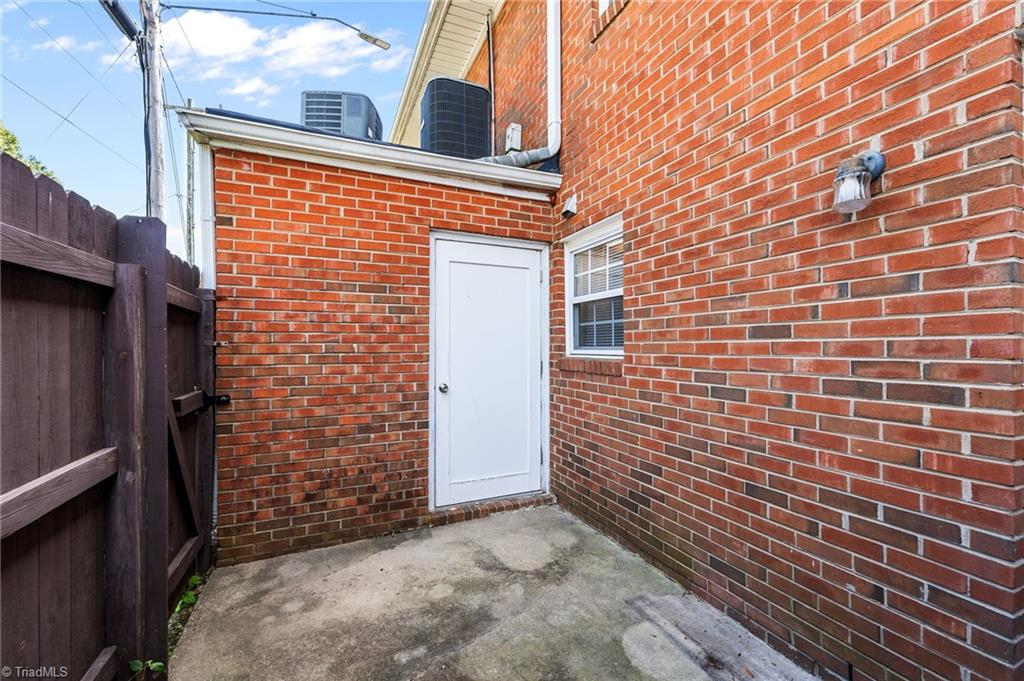 1315 West Meadowview Road, Unit G Greensboro, NC 27403 - Photo 17 of 17 REAR FENCED PATIO AND EXTERIOR STORAGE