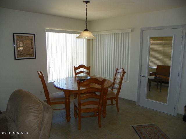 1809 Círculo Tortuga Rio Rico, AZ 85648 - Photo 11 of 26 a view of a dining room with furniture window and outside view