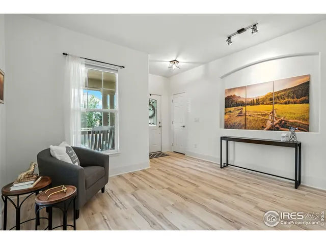 a bedroom with a bed and a chair