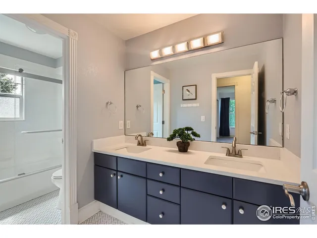 a living room with a flat screen tv and outdoor space