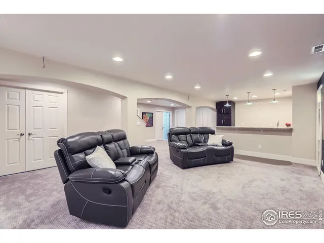 a view of kitchen with kitchen island a sink stainless steel appliances and cabinets