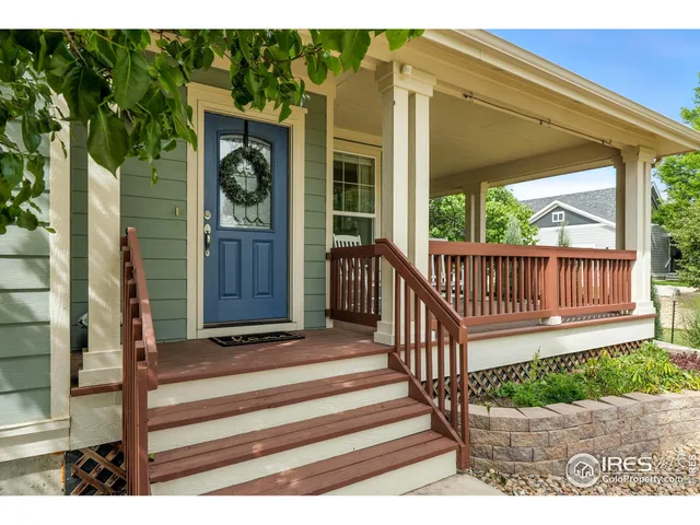 a view of a house with backyard porch and sitting area