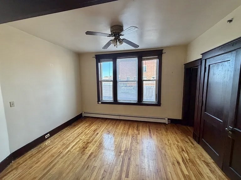 27 High Street, Unit 1 Clinton, MA 01510 - Photo 10 of 30 a view of an empty room with wooden floor and a window