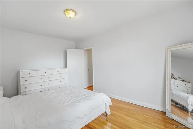 a bedroom with a bed and cabinets