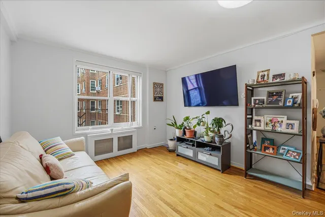 a living room with furniture and book shelf