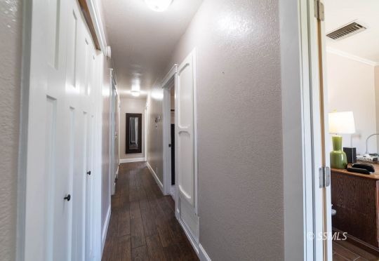 313 East Haloid Avenue Ridgecrest, CA 93555 - Photo 24 of 39 a view of hallway with wooden floor