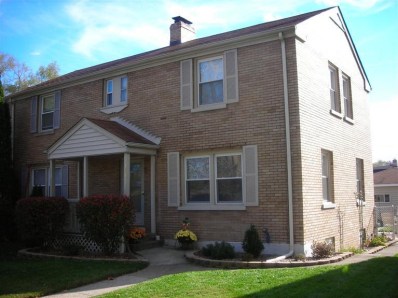 324 Beacon Place Munster, IN 46321 - Photo 1 of 10 a front view of a house with a yard