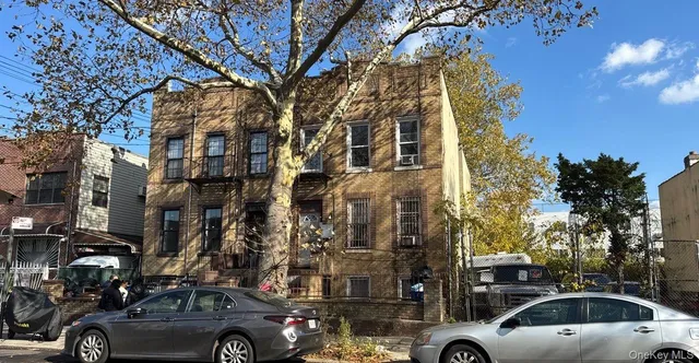 a view of parking with cars parked