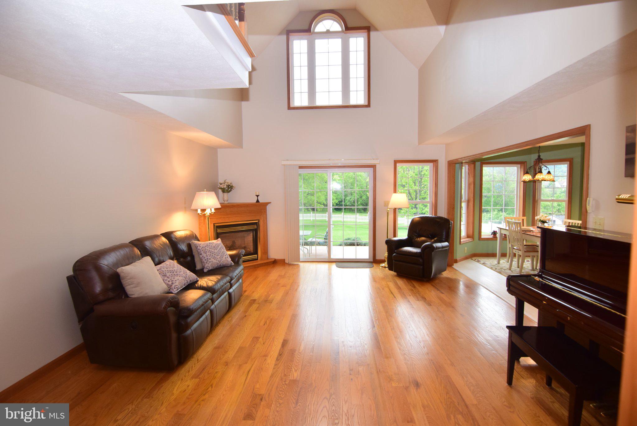 470 Millgate Road Bellefonte, PA 16823 - Photo 13 of 63 a living room with furniture fireplace and a large window