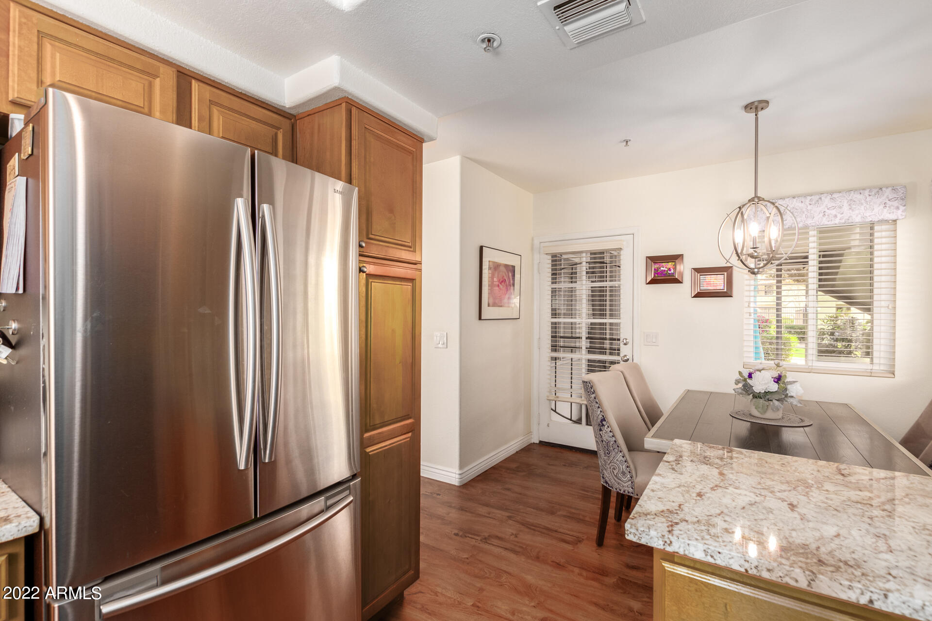 1825 West Ray Road, Unit 1049 Chandler, AZ 85224 - Photo 11 of 28 a kitchen with stainless steel appliances granite countertop a refrigerator and a stove