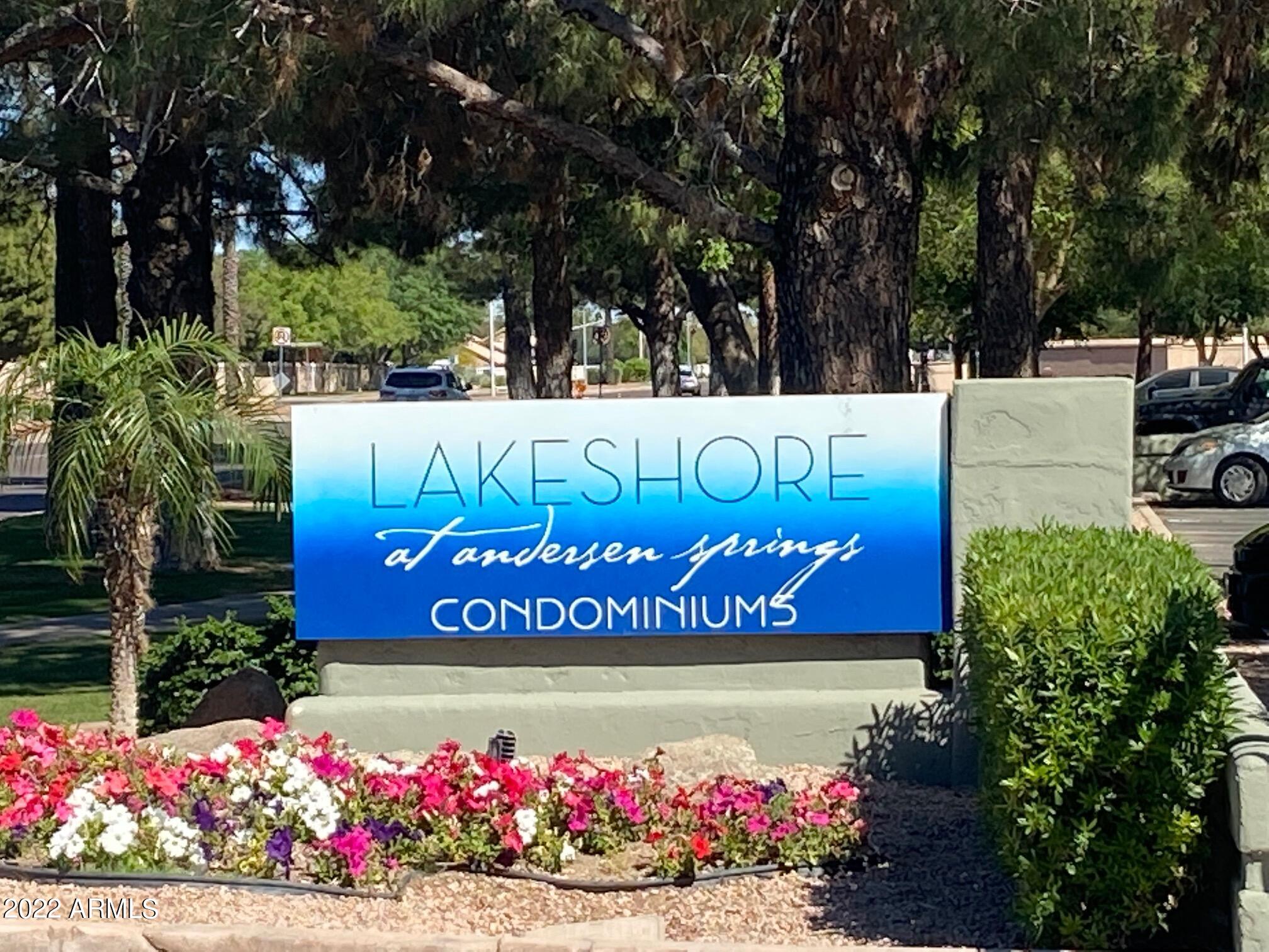 1825 West Ray Road, Unit 1049 Chandler, AZ 85224 - Photo 24 of 28 a sign that is sitting in front of flowers