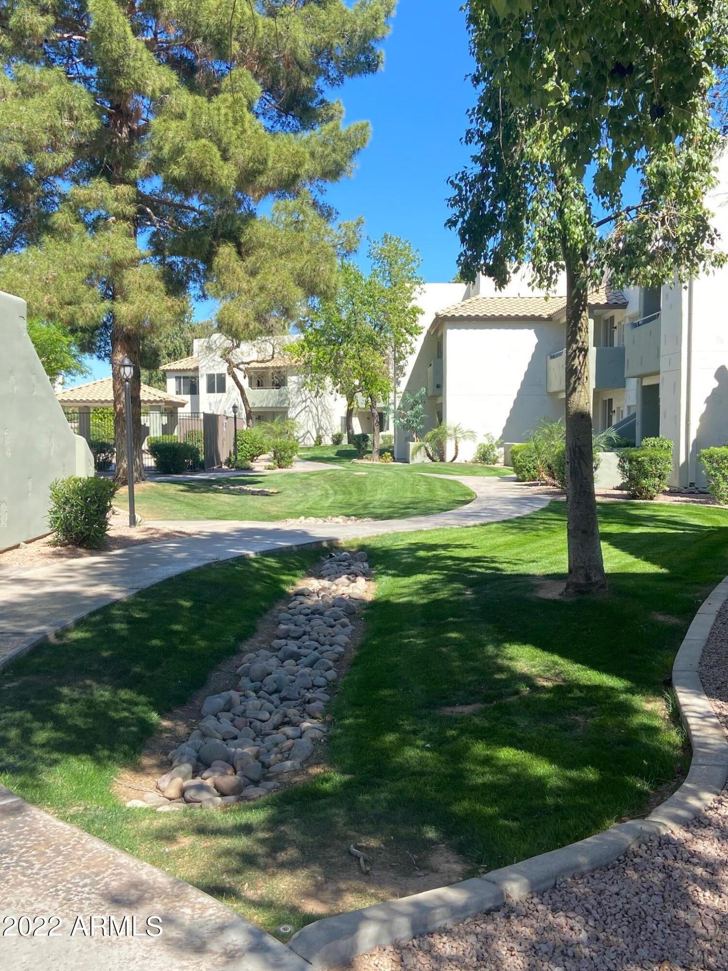 1825 West Ray Road, Unit 1049 Chandler, AZ 85224 - Photo 26 of 28 a view of a playground with a yard