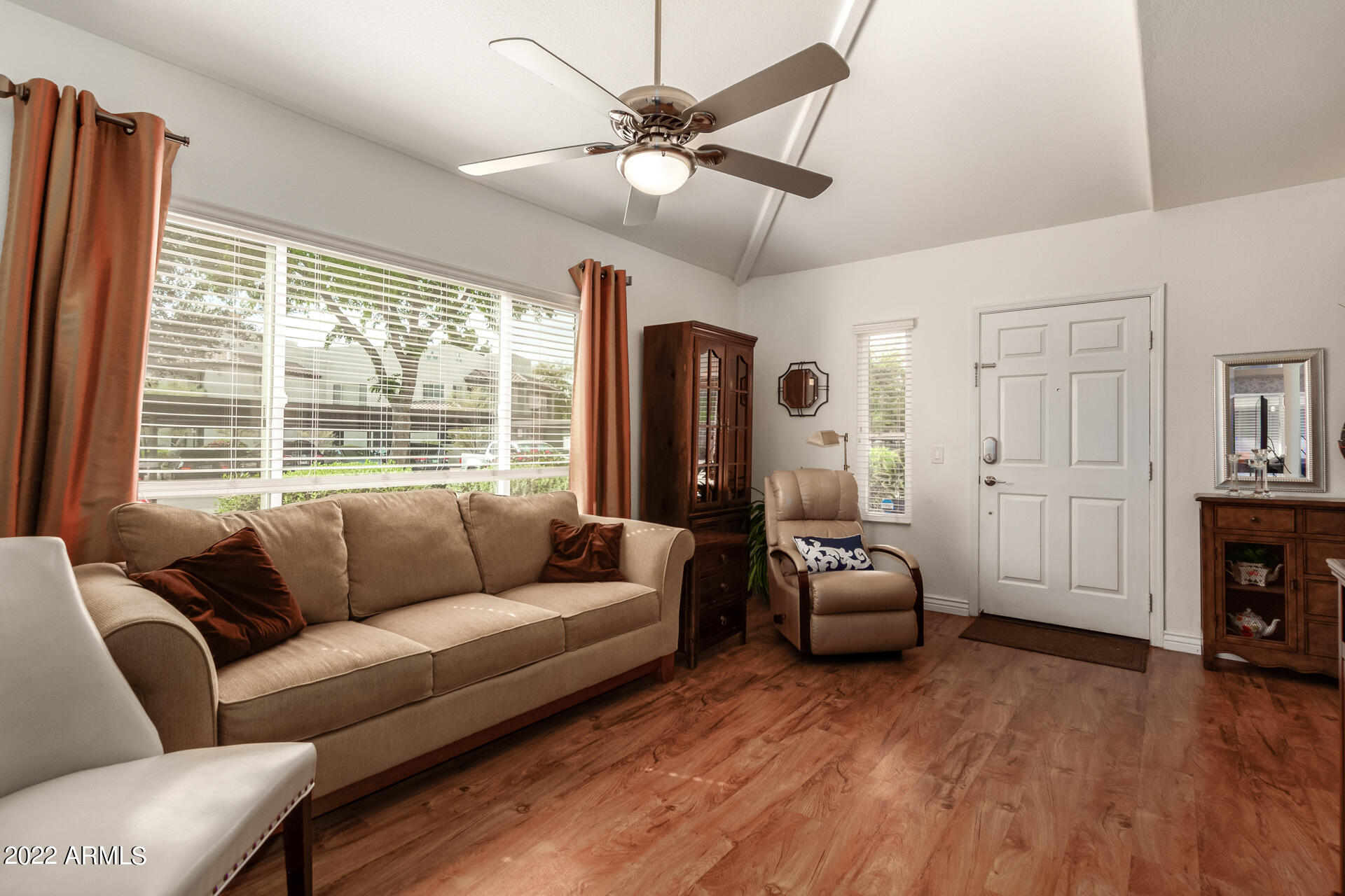 1825 West Ray Road, Unit 1049 Chandler, AZ 85224 - Photo 5 of 28 a living room with furniture and a fireplace