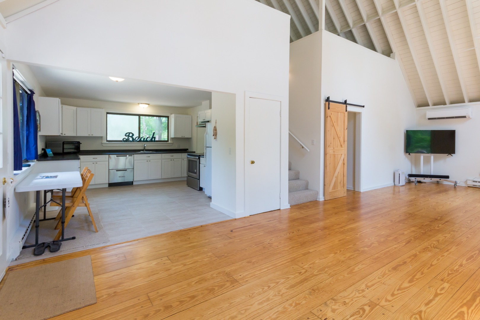 81 Marthas Road Edgartown, MA 02539 - Photo 11 of 23 a large white kitchen with a large window