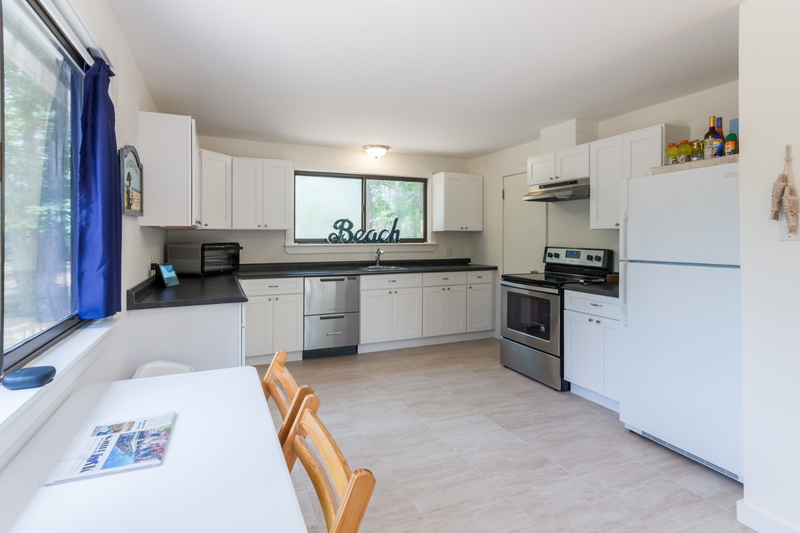 81 Marthas Road Edgartown, MA 02539 - Photo 12 of 23 a kitchen with granite countertop a refrigerator stove top oven and sink