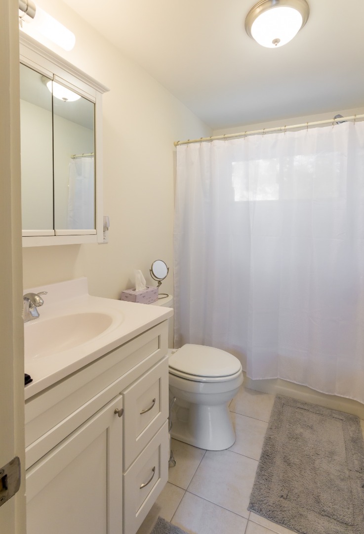 81 Marthas Road Edgartown, MA 02539 - Photo 13 of 23 a bathroom with a sink a toilet and a mirror