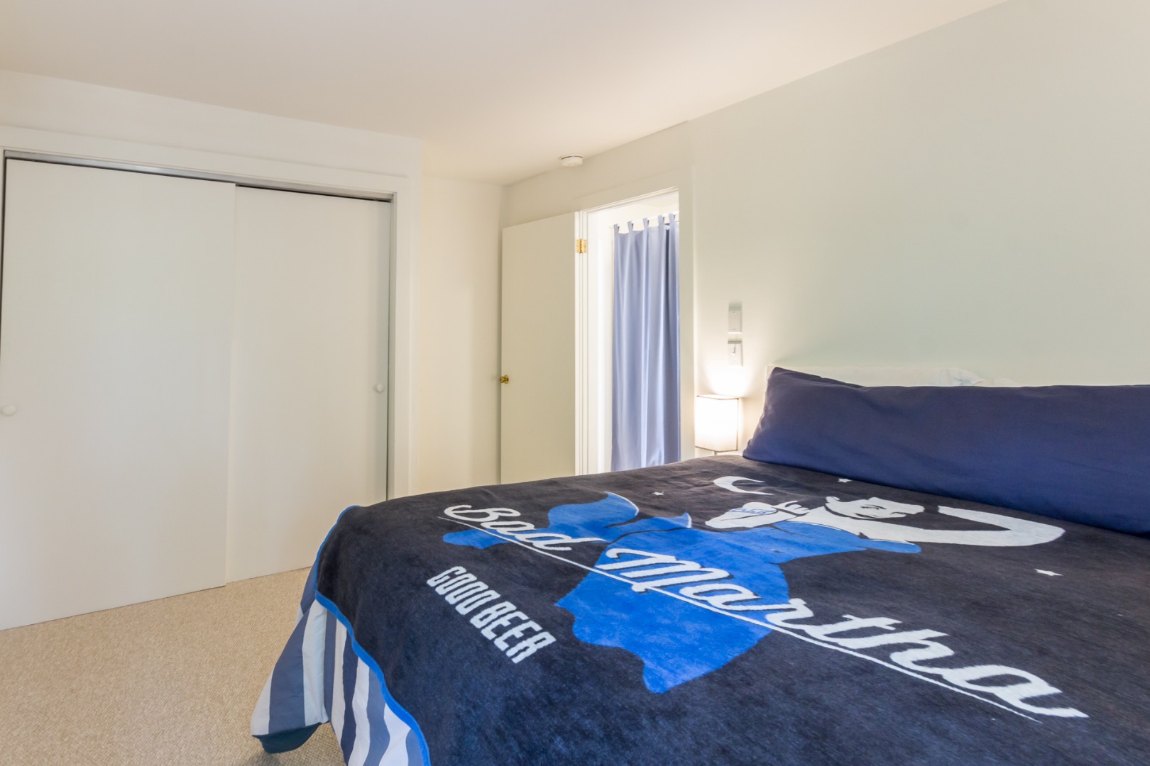 81 Marthas Road Edgartown, MA 02539 - Photo 16 of 23 a bedroom with a bed and wooden floor
