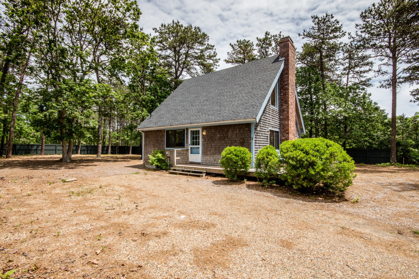 81 Marthas Road Edgartown, MA 02539 - Photo 2 of 23 a view of a house with backyard and sitting area