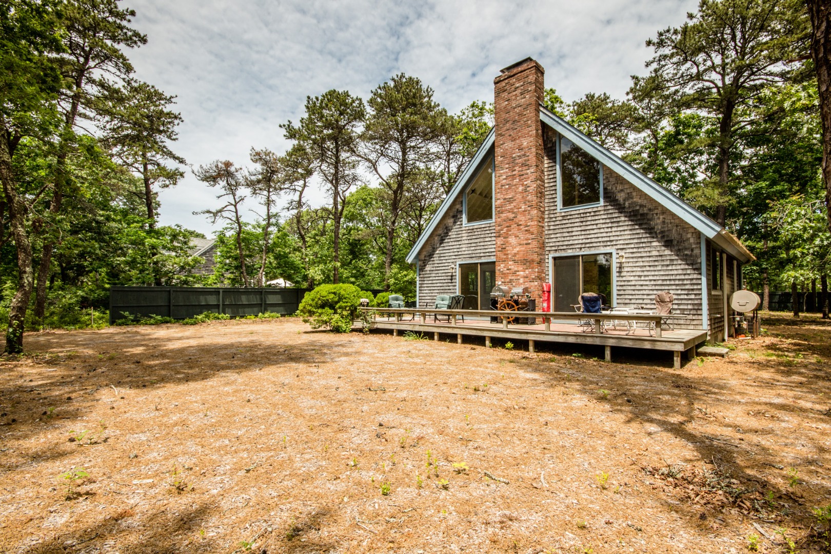 81 Marthas Road Edgartown, MA 02539 - Photo 4 of 23 a view of a house with a yard and sitting area