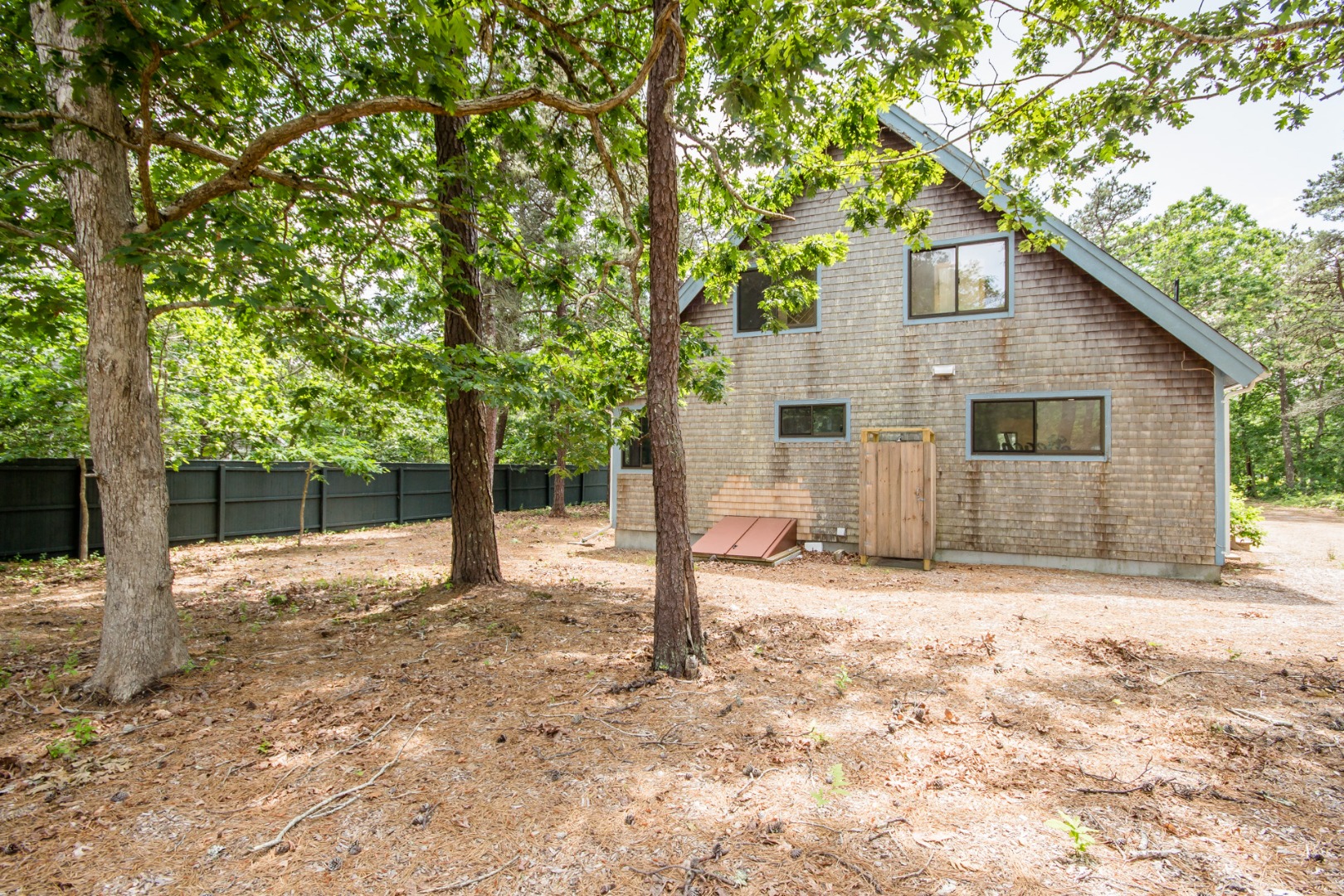 81 Marthas Road Edgartown, MA 02539 - Photo 5 of 23 a house with trees in the background