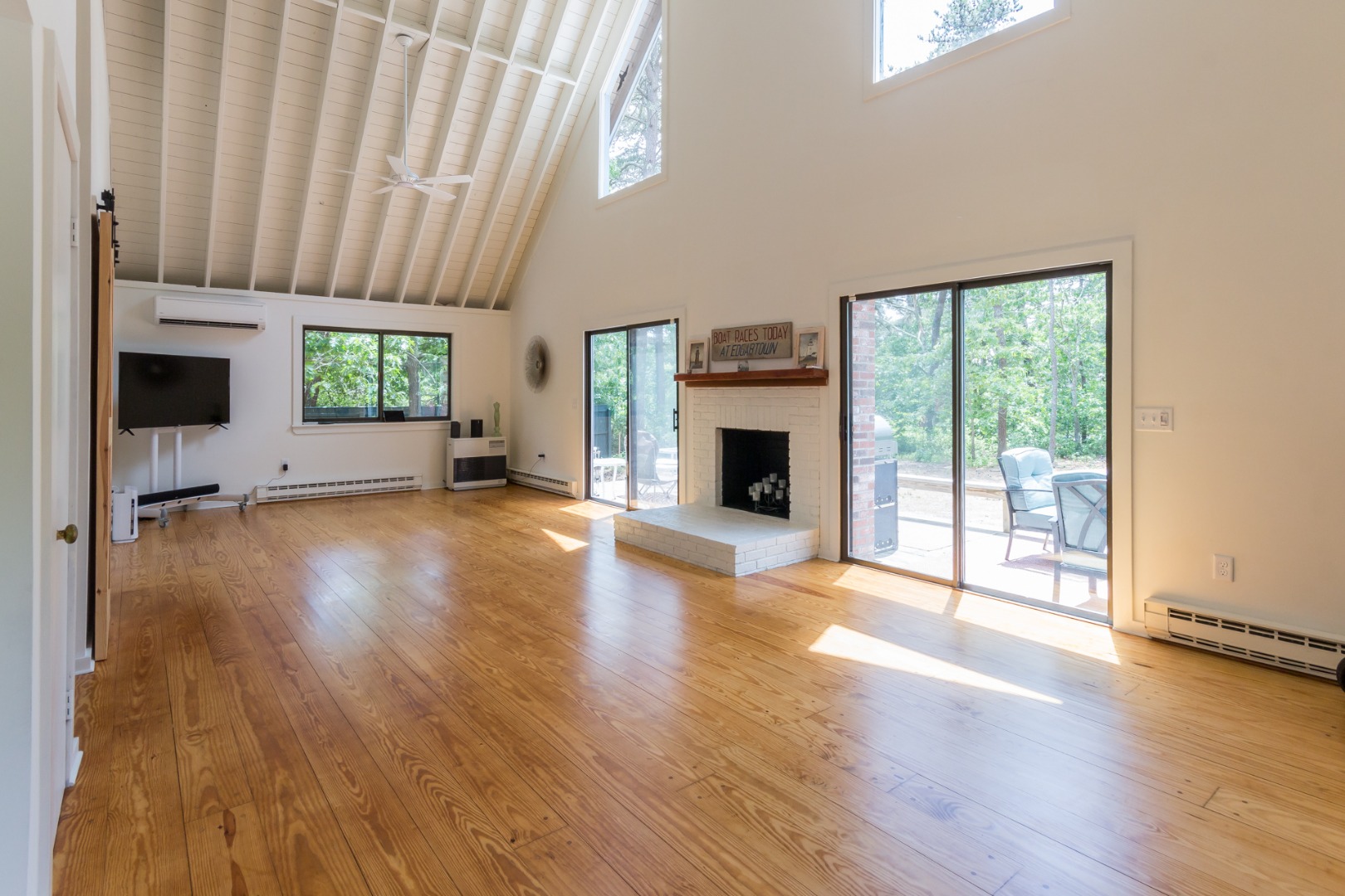 81 Marthas Road Edgartown, MA 02539 - Photo 23 of 23 a view of empty room with wooden floor and fireplace