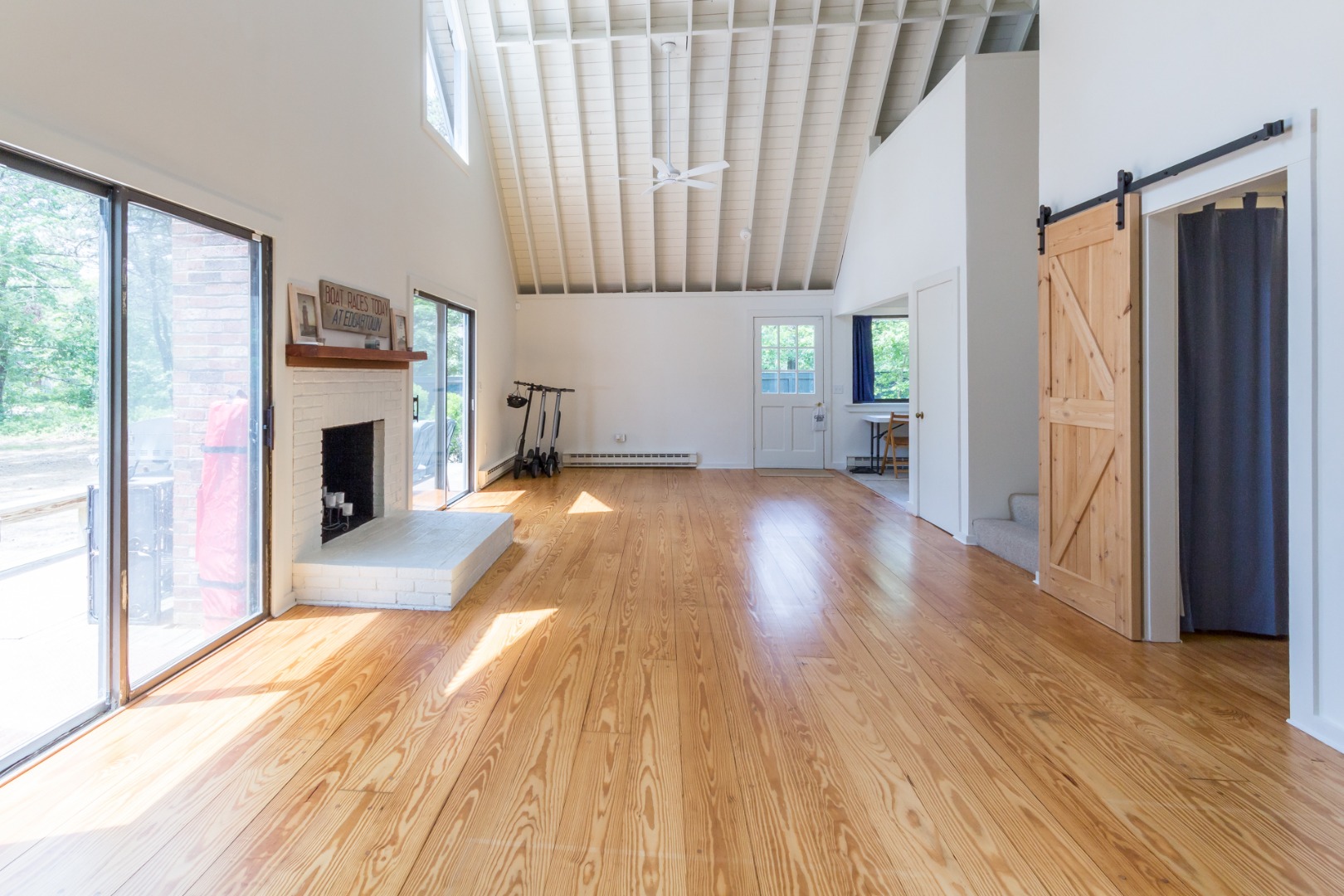 81 Marthas Road Edgartown, MA 02539 - Photo 9 of 23 a view of a house with wooden floor and a fireplace