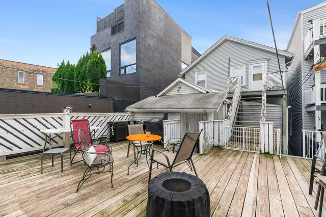 a view of a house with pool and chairs