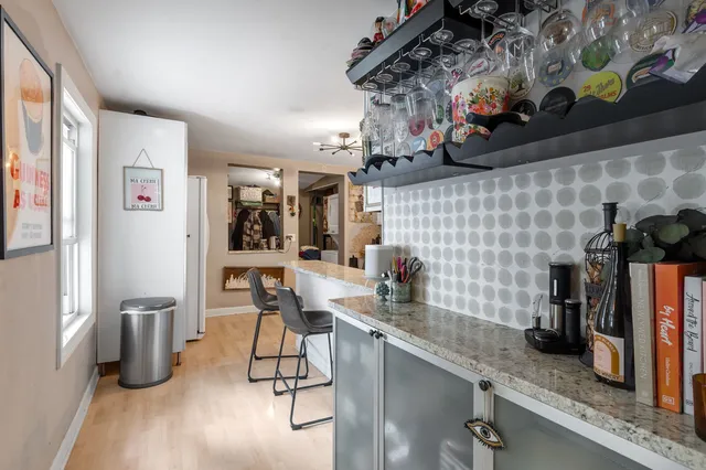 a kitchen with a sink and cabinets