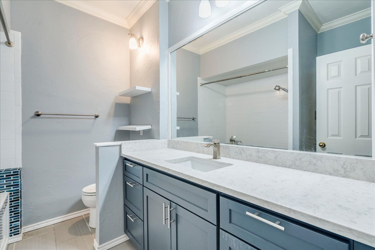 3809 Spicewood Springs Road, Unit 127 Austin, TX 78759 - Photo 19 of 29 A refined primary bathroom features a large vanity with ample storage and a spacious mirror.