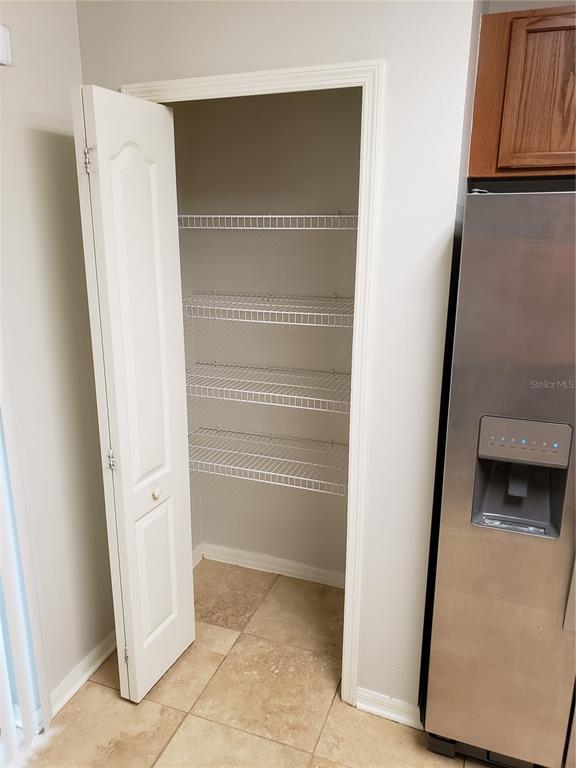 5870 Fishhawk Ridge Drive Lithia, FL 33547 - Photo 14 of 34 a view of walk in closet with empty racks