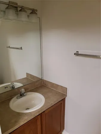 an empty room with closet and mirror