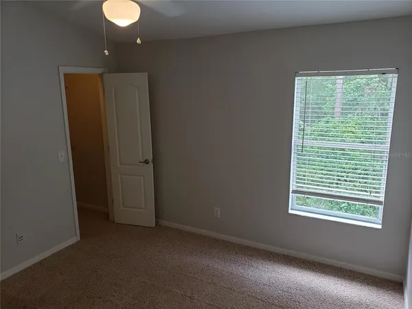 a white toilet sitting next to a bath tub