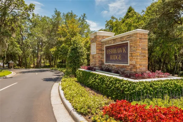 a view of a house with swimming pool and a yard
