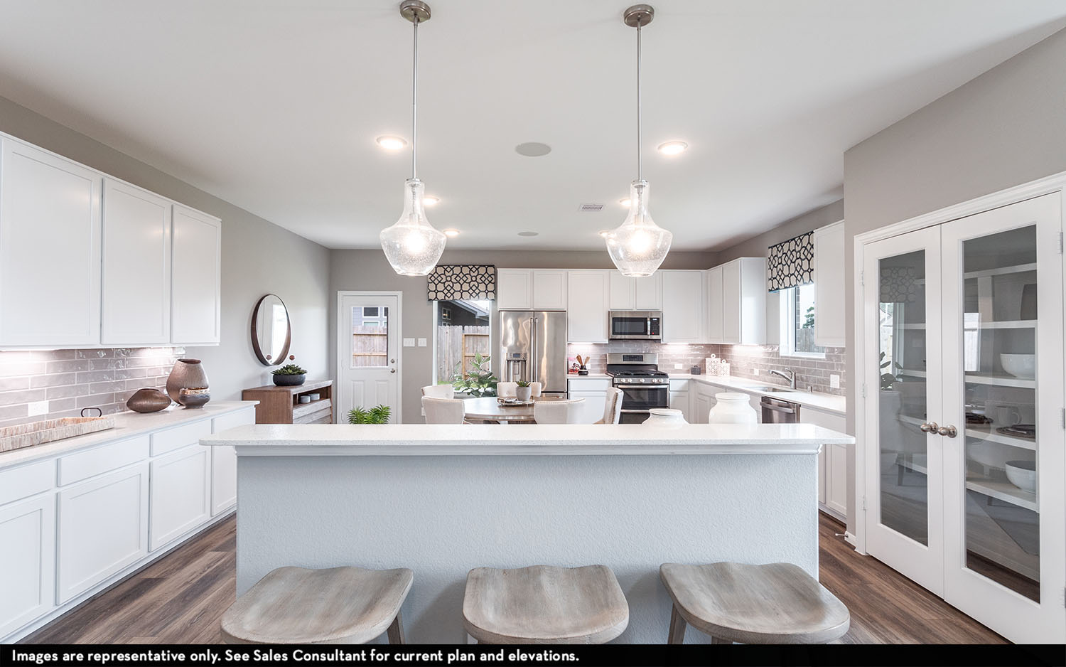 25612 Becky Bourn Lane Elgin, TX 78621 - Photo 6 of 20 a kitchen with kitchen island granite countertop a sink cabinets and stainless steel appliances