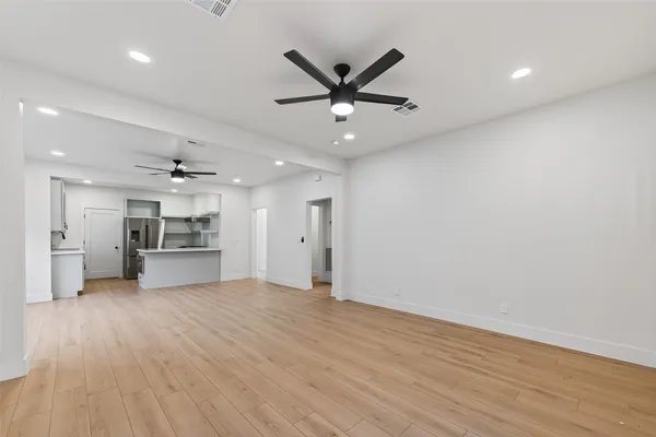 a view of a kitchen with a sink and a stove
