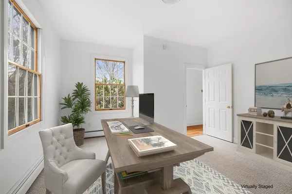 a view of a hallway with seating area
