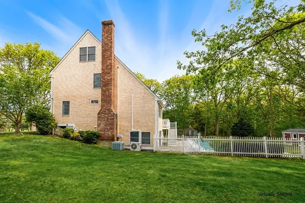 a spacious bedroom with a bed and a flat screen tv