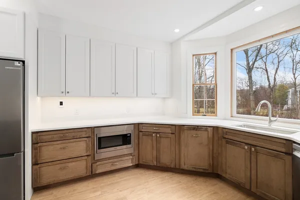 a kitchen with a sink and cabinets