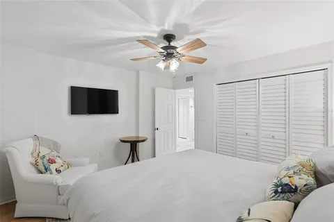 a bathroom with a granite countertop sink a toilet and a mirror