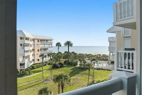 a view of a balcony with furniture