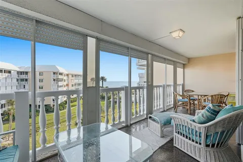 a dining room with furniture window and outside view