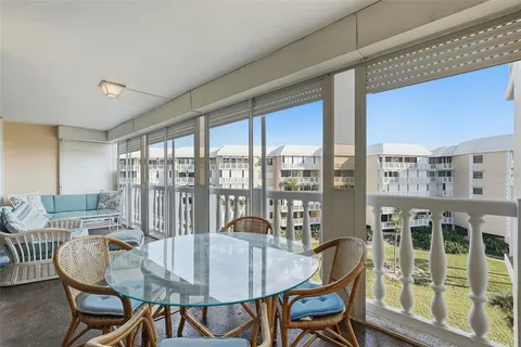 a bedroom with furniture and large window