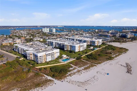 a room with pool table and windows