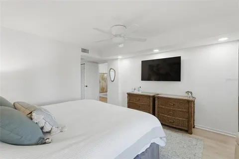 a bathroom with a granite countertop double vanity sink and a mirror