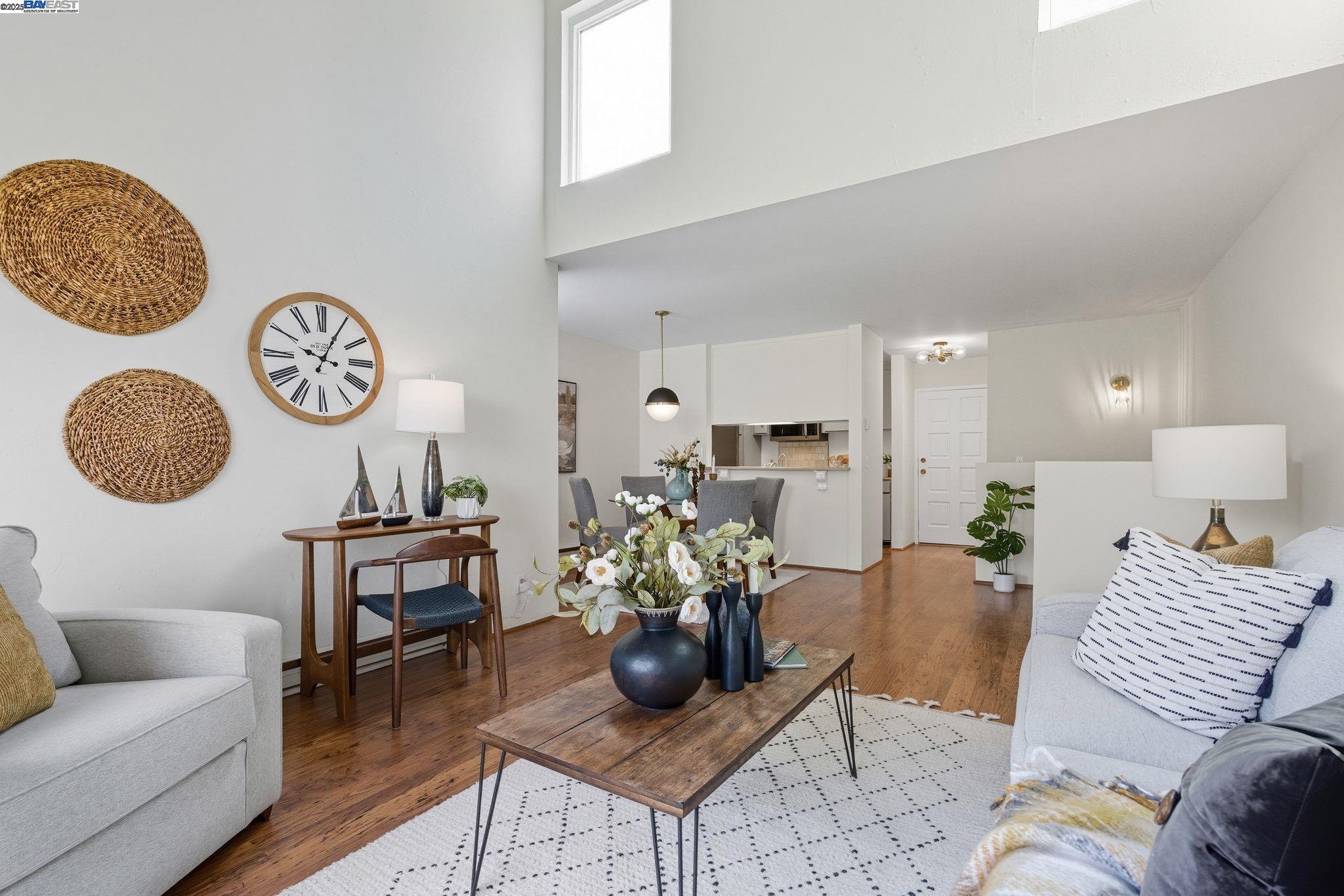 a living room with furniture flowerpot and window