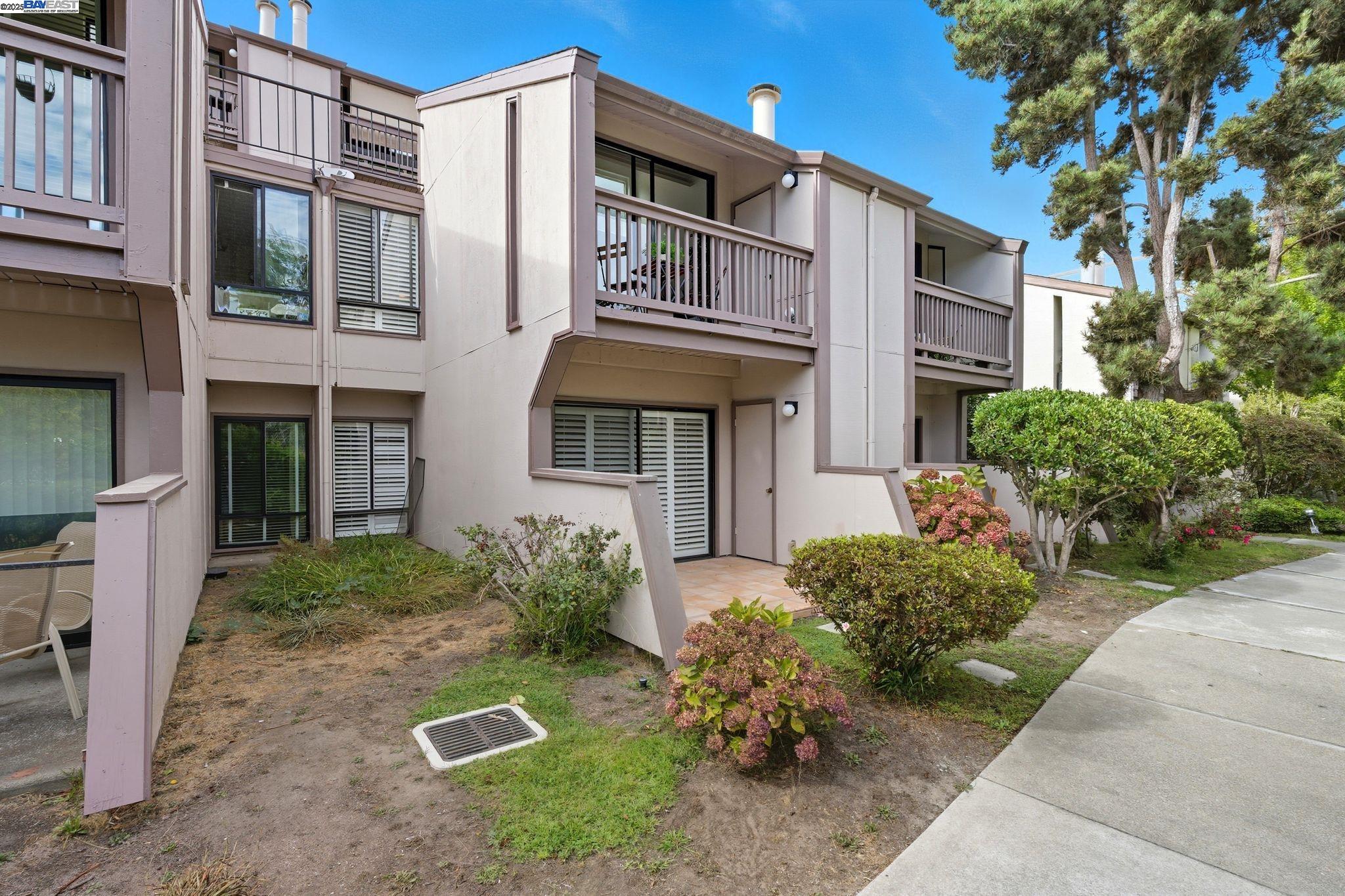 2101 Shore Line Drive, Unit 233 Alameda, CA 94501 - Photo 12 of 47 a front view of a house with a yard